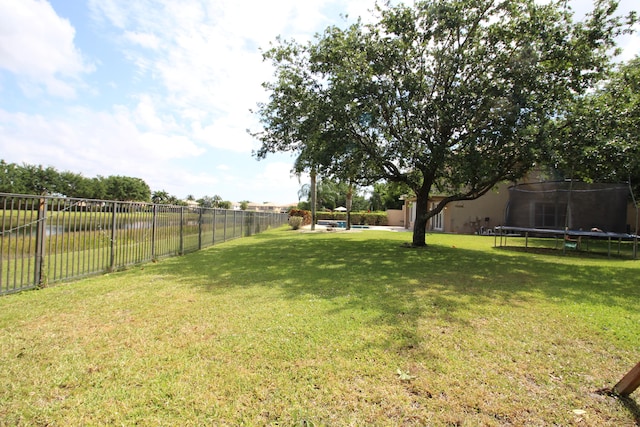 view of yard with a trampoline