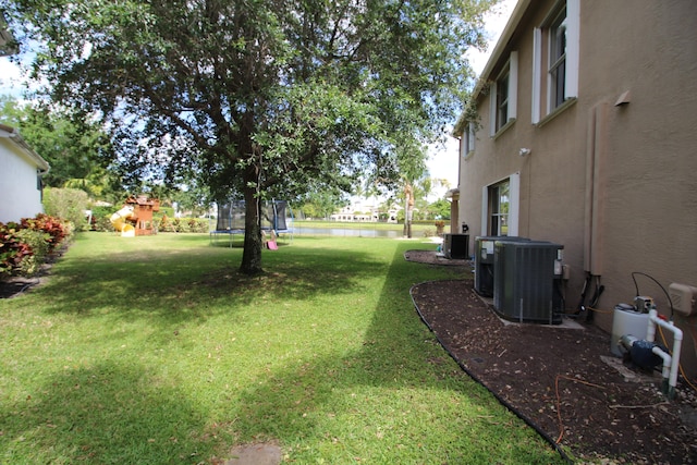 view of yard featuring central AC unit