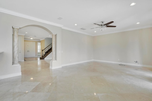 tiled empty room with ornamental molding, ceiling fan, and decorative columns