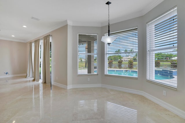 empty room featuring tile flooring and ornamental molding