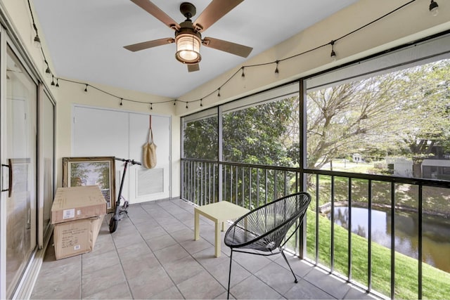 sunroom / solarium featuring ceiling fan and a wealth of natural light