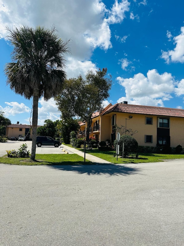 view of property exterior with a lawn