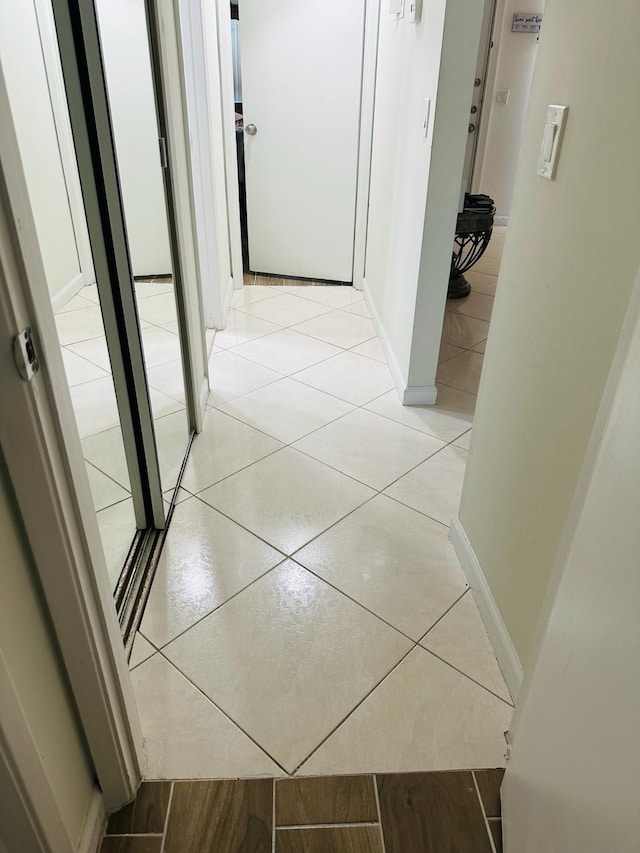 corridor featuring light tile patterned flooring