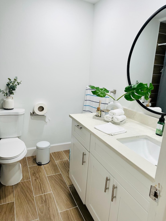 bathroom featuring vanity and toilet