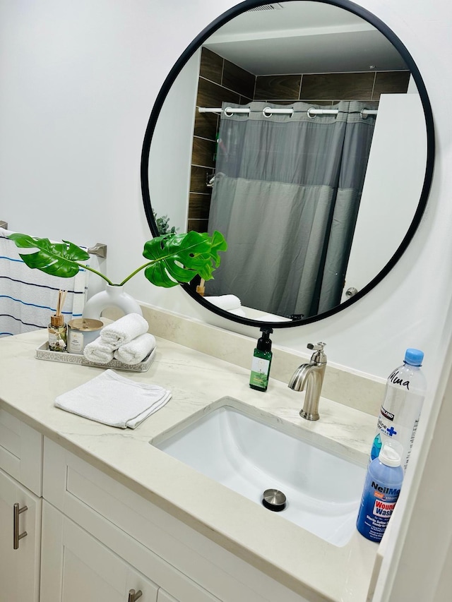 bathroom with vanity and walk in shower