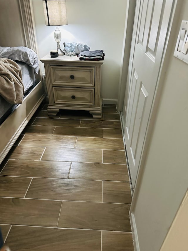 hallway with dark wood-type flooring