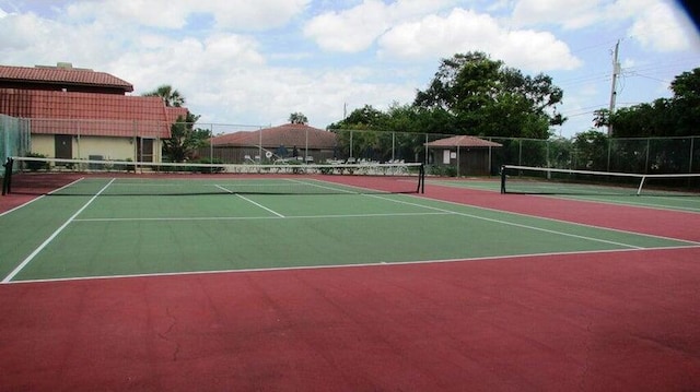 view of tennis court featuring basketball court