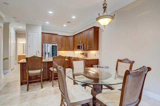 tiled dining area with crown molding