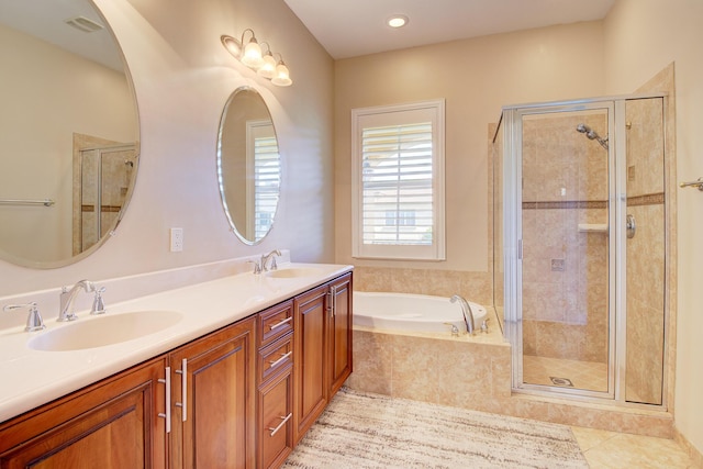 bathroom with vanity, tile patterned floors, and independent shower and bath