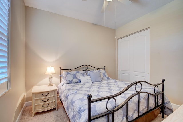 bedroom featuring carpet floors, a closet, and ceiling fan