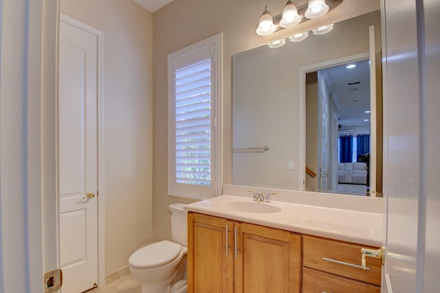 bathroom with vanity and toilet