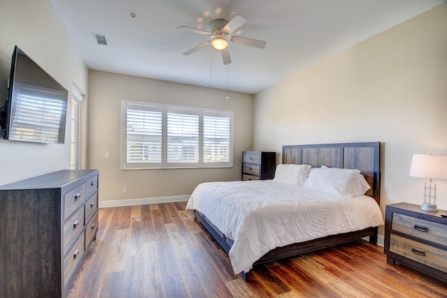 bedroom featuring dark hardwood / wood-style floors and ceiling fan