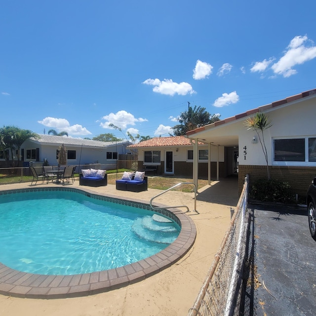 view of swimming pool featuring a patio