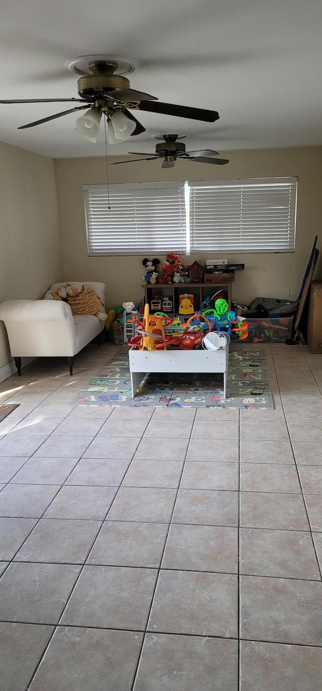 unfurnished bedroom featuring ceiling fan and light tile floors