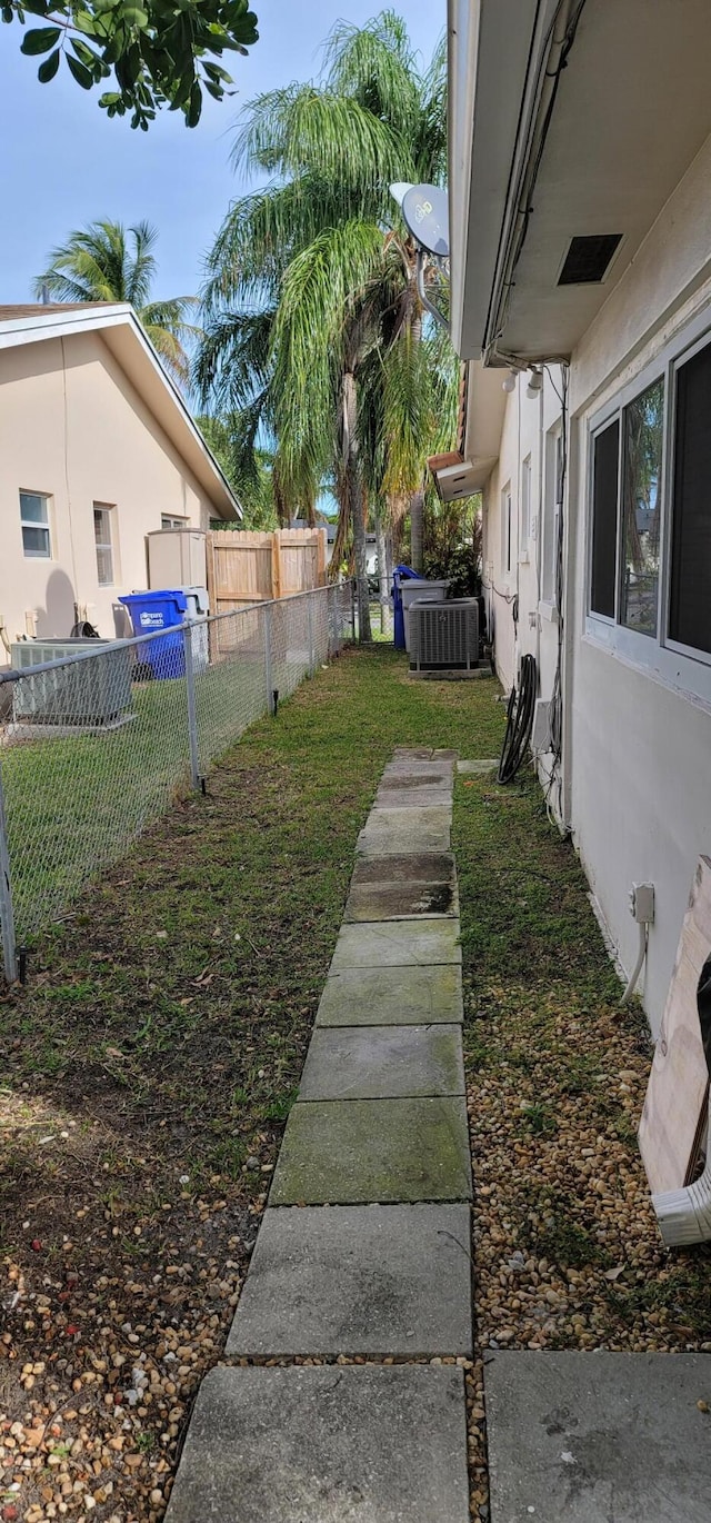 view of yard featuring central AC unit