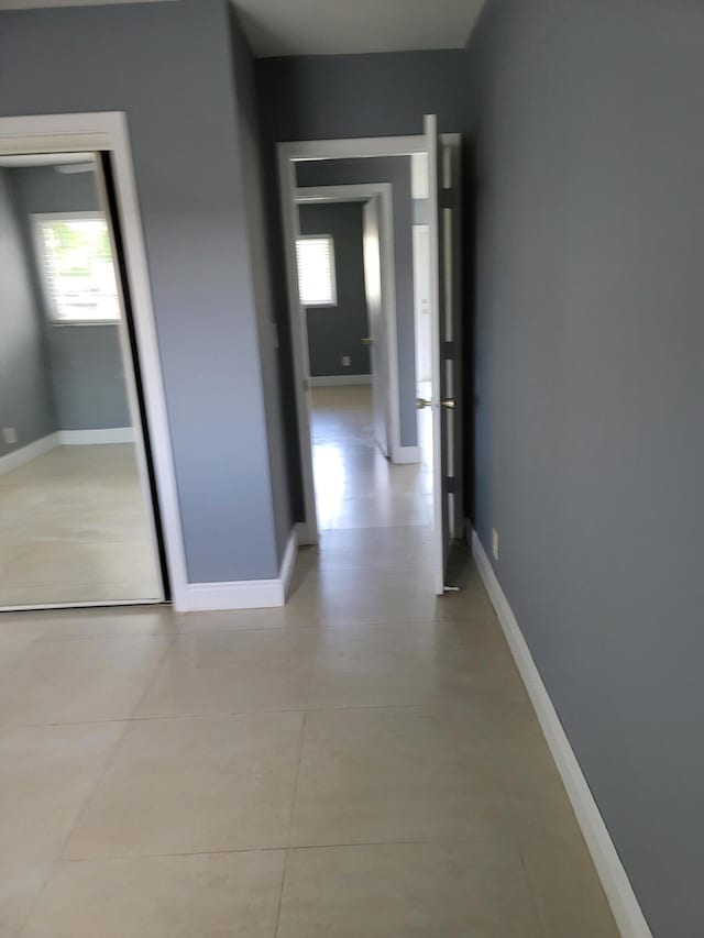 hallway with light tile flooring