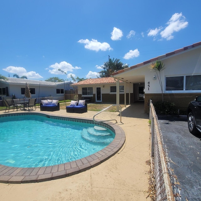 view of pool featuring a patio