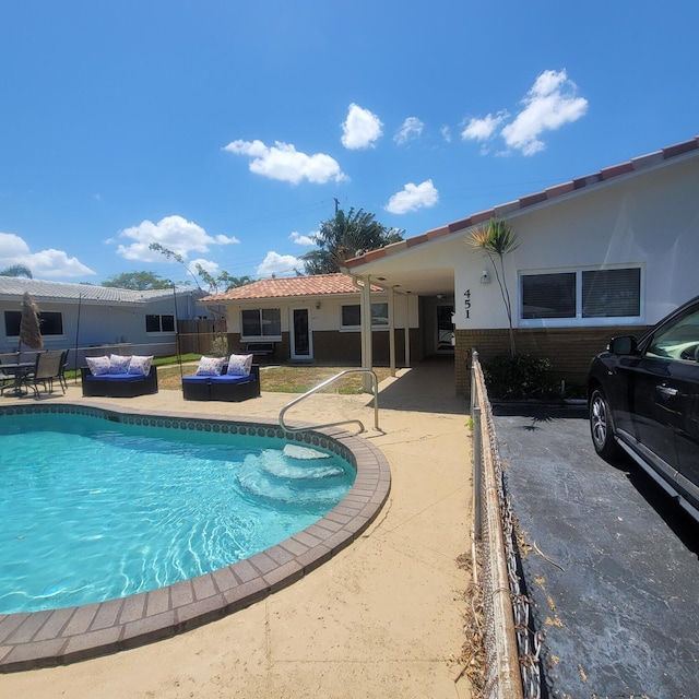 view of pool featuring a patio area