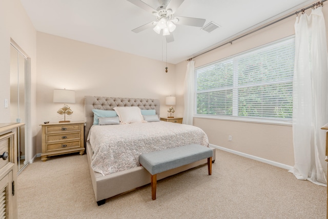 carpeted bedroom featuring ceiling fan