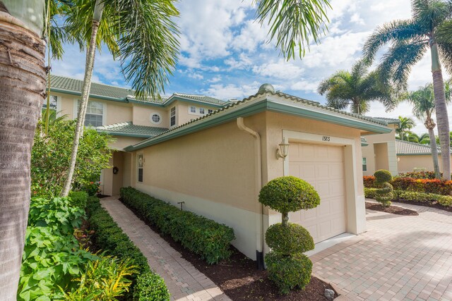 view of side of home featuring a garage