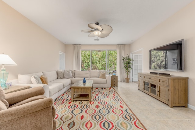 tiled living room featuring ceiling fan