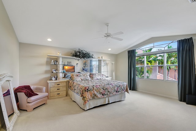 bedroom featuring ceiling fan, light colored carpet, and vaulted ceiling