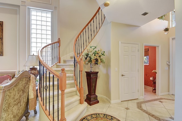 entrance foyer with light tile patterned floors