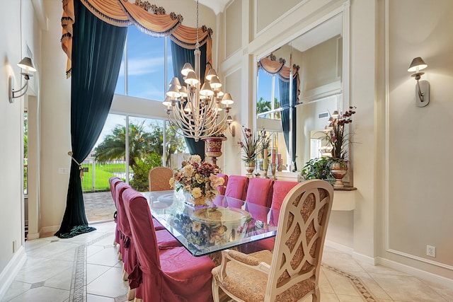 tiled dining area featuring a chandelier