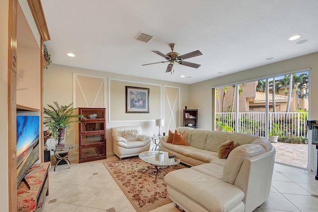 living room featuring ceiling fan and light tile patterned floors