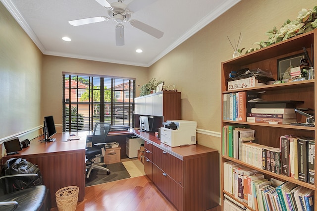 office area with light wood-type flooring, ceiling fan, and crown molding