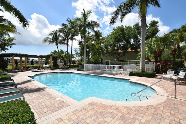 view of swimming pool featuring a pergola and a patio area