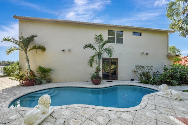 view of swimming pool with a patio