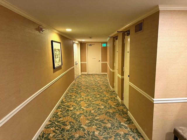 hallway with carpet and crown molding