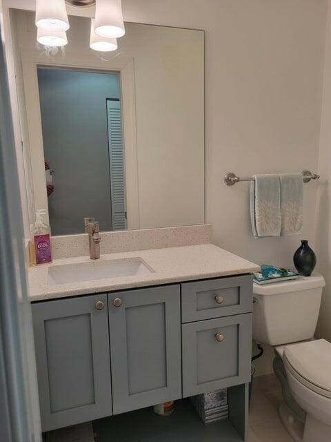 bathroom featuring vanity and toilet