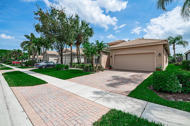 view of front facade featuring a garage and a front lawn