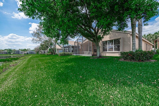 view of yard featuring a lanai