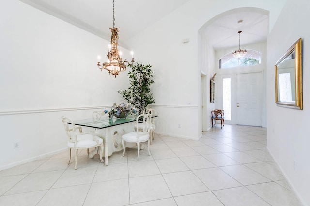 tiled dining area featuring a notable chandelier