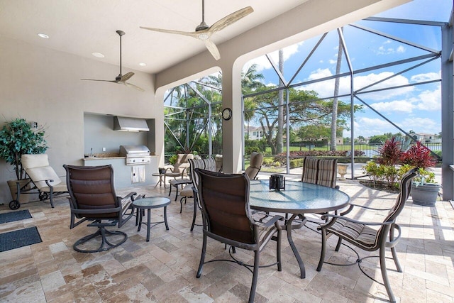 sunroom / solarium featuring ceiling fan