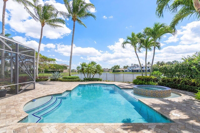 view of swimming pool featuring glass enclosure, a patio area, and an in ground hot tub