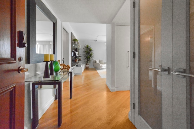 corridor featuring light hardwood / wood-style flooring