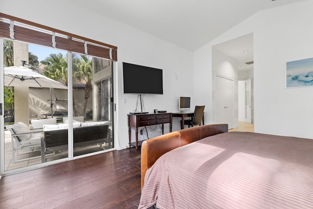 bedroom featuring access to outside, vaulted ceiling, and dark hardwood / wood-style flooring