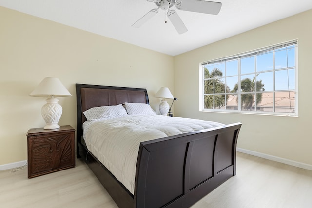 bedroom featuring ceiling fan and light wood-type flooring