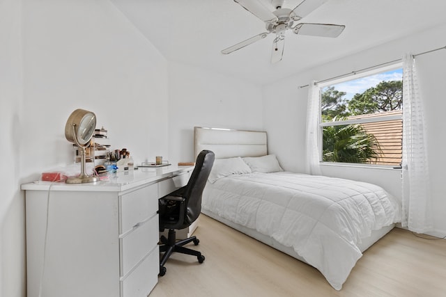 bedroom with ceiling fan and light hardwood / wood-style flooring