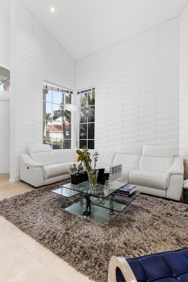 living room featuring high vaulted ceiling