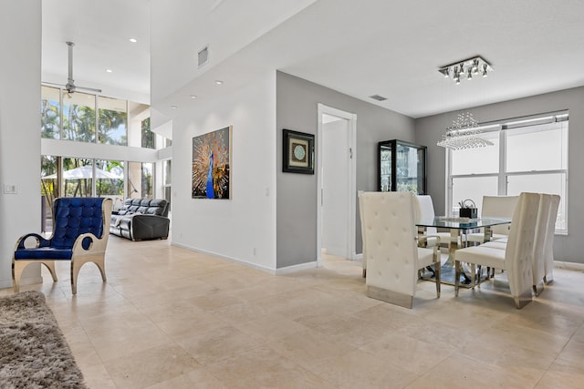 tiled dining area featuring ceiling fan