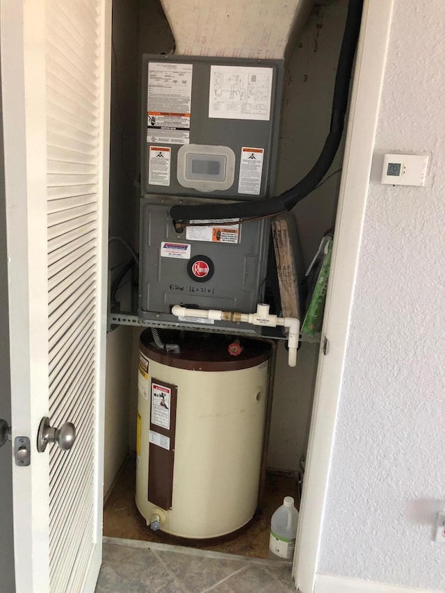 utility room with gas water heater