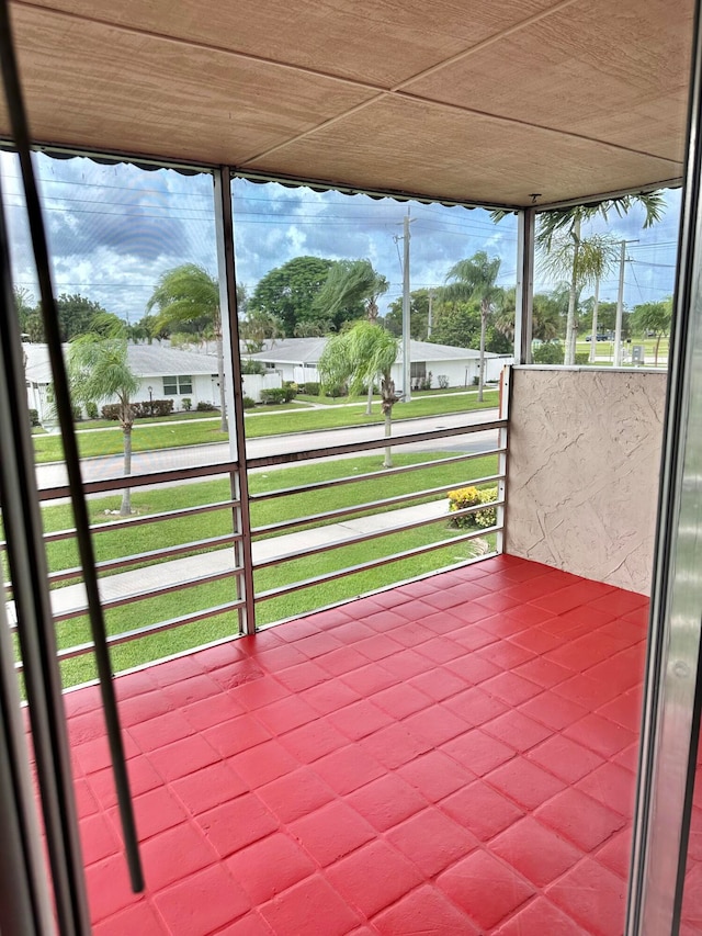 unfurnished sunroom featuring plenty of natural light