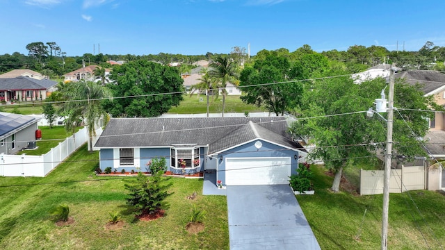 view of front of property with a garage and a front yard