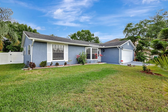 ranch-style home with a garage and a front yard