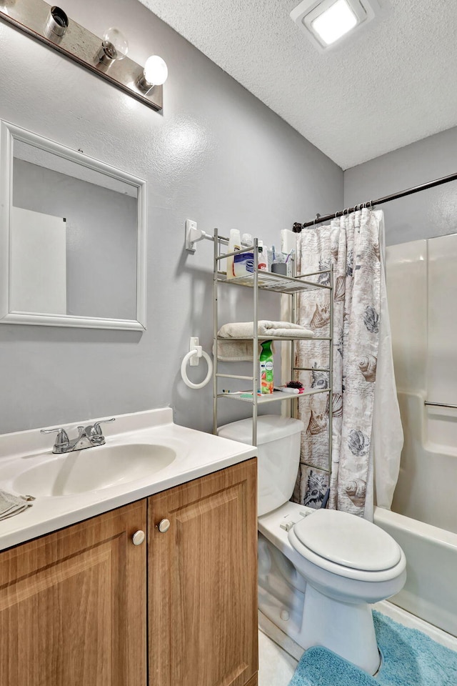 full bathroom featuring a textured ceiling, vanity, shower / bathtub combination with curtain, and toilet